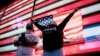 Supporters of President-Elect Joe Biden and Vice-President-Elect Kamala Harris gather in New York City's Time Square to watch a Biden speech after news organizations called the 2020 presidential election for the Democratic Party's candidate. 