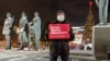 In Novosibirsk ahead of unauthorized January 23, 2021 demonstrations for opposition leader Aleksei Navalny's release from jail, a lone protester holds a sign that reads "Putin is afraid of Navalny." 