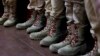 Обувь курсантов российского патриотического молодежного движения "Юнармия", которые принимают участие в церемонии награждения 7-летнего школьника за рисунки, послания и подарки, которые он отправил российским солдатам, воюющти в Украине, фото AFP^, 24 января 2025 года