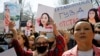 Kyrgyz attend an April 8, 2021 rally in Bishkek to demand the resignation of the interior minister for the alleged inaction of police in response to the kidnapping of Aizada Kanatbekova, who was found murdered. 