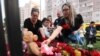RUSSIA -- TATARSTAN -- A woman places a toy at a makeshift memorial for victims of the shooting at School No. 175 in Kazan on May 11, 2021.